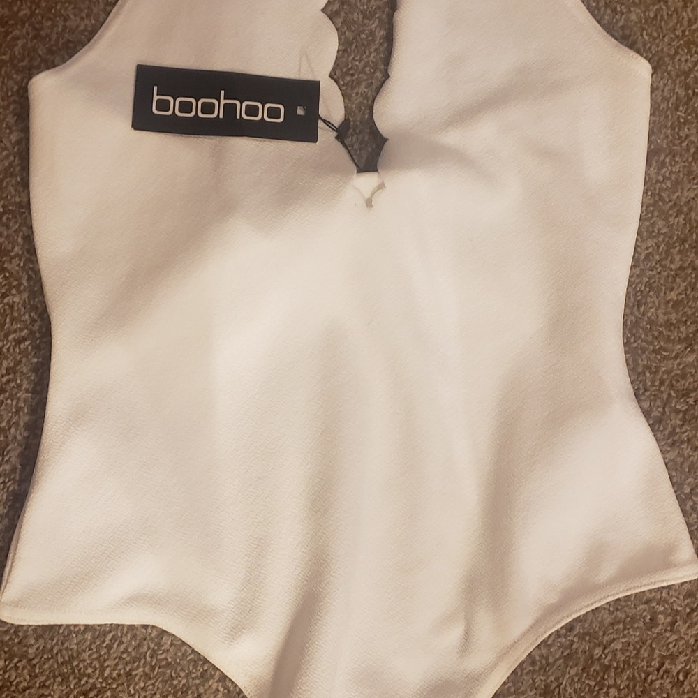 Cream/White, scalloped edge halter bodysuit.